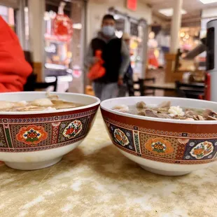 two bowls of soup on a table