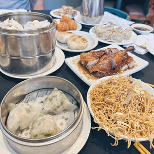 Shrimp dumpling, bbq steamed bun, yellow noodles, roast duck, shrimp balls, pan fried pork bun, turnip cakes, jasmine tea