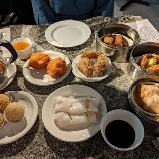 Sesame balls, crabmeat claw, shrimp rice roll, fried taro pie, stuffed eggplant with shrimp, chicken feet, tofu with shrimp