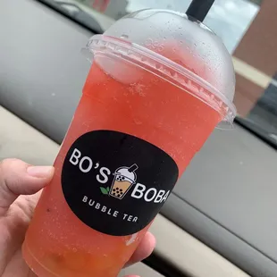 Raspberry slushy with passion fruit popping boba !