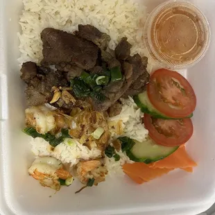 This is what $18 gets you... FOUR shrimp small amount of rice and a few slices of pork. EMBARRASSING for a business