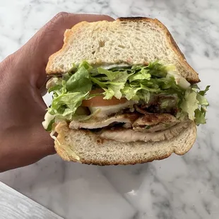 chicken club: marinated chicken breast topped with bacon = $10.95