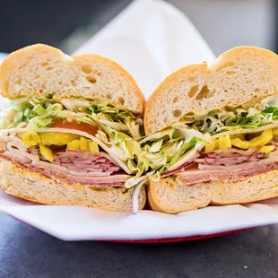 a sandwich with meat and vegetables