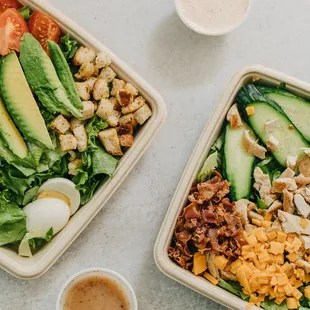 two bowls of salad and a cup of coffee