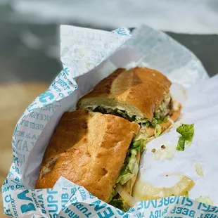a sandwich wrapped in paper