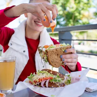 a woman eating a sandwich