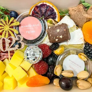 Personal size charcuterie &quot;board&quot; with New Years theme decor