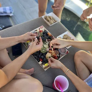 a group of people sitting around a table