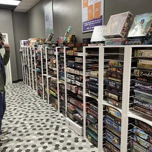 a man taking a picture in a game store