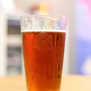 a glass of beer on a table