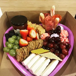 a variety of cheese and fruit