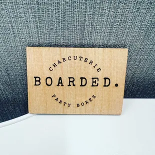 a close up of a wooden sign