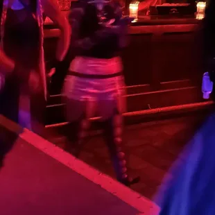 a woman dancing in a bar