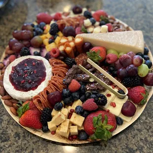 a platter of fruit and cheese