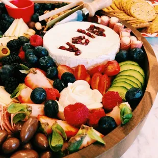 a platter of fruit and cheese