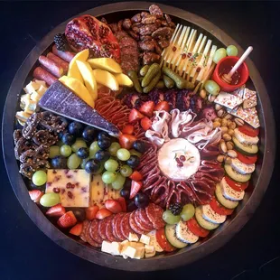 a platter of meat and cheeses