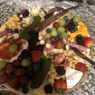 a platter of fruit and cheese