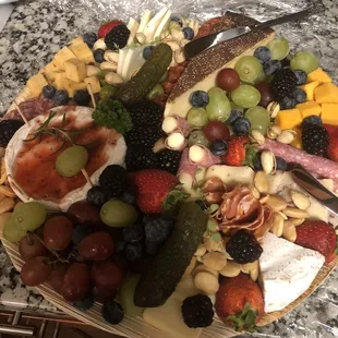 a platter of fruit and cheese