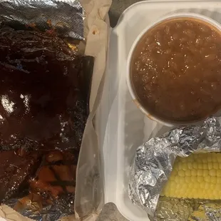 Ribs and brisket with bbq beans and cobbed corn.
