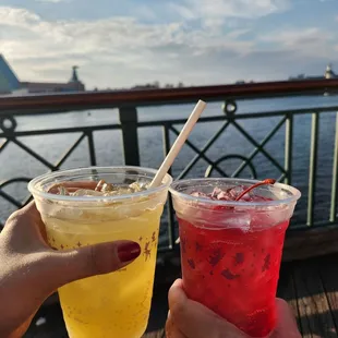 two people toasting with drinks