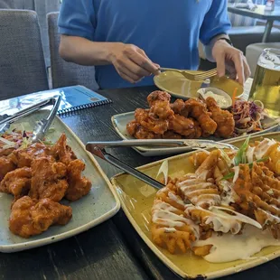 Cauliflower wings, buffalo wings and cheddar garlic waffle fries