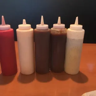 Awesomeness in a bucket. From left to right, good ol&apos; ketchup, creamy buffalo, BBQ, &quot;Delta Sauce&quot; (southern vinegar sauce, and ranch