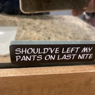 a sign that says should've left my pants on last nite