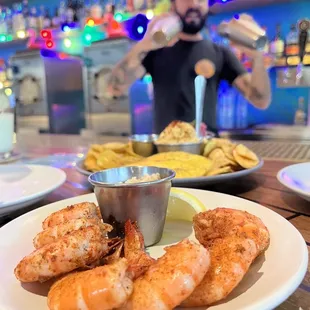 a plate of shrimp and chips