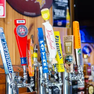 a row of beer taps