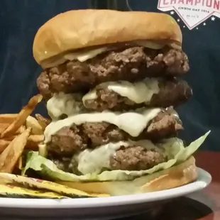 This is the 2 pound cheeseburger my son ate. Perfection on a bun . Juicy and cooked perfectly. Hot pepper cheese and sweet grilled onions