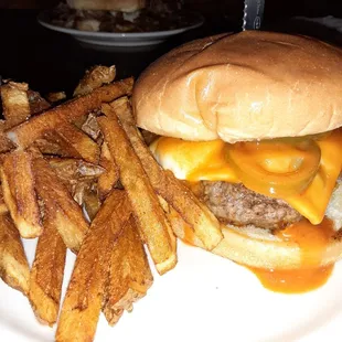 a cheeseburger and fries on a plate