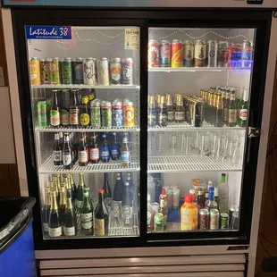a refrigerator full of drinks and beverages