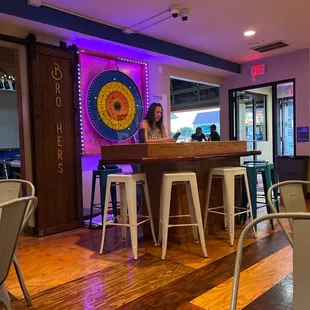 a woman sitting at a bar