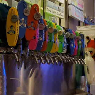 a row of beer taps