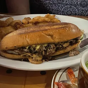 Roast beef with cheddar and mushrooms and onion petals.