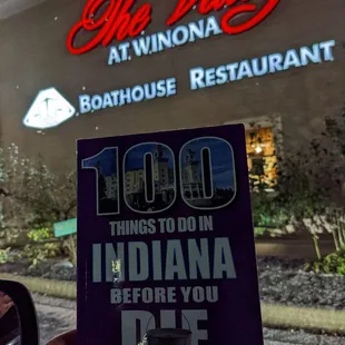 a person holding up a book