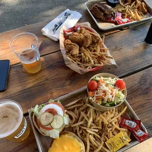 Sandwich (cheeseburger) w/two sides (fries, side salad), kids chicken tender meal and signature (brisket) w/two sides (fries, onion rings).