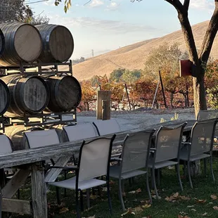 a table with chairs and barrels
