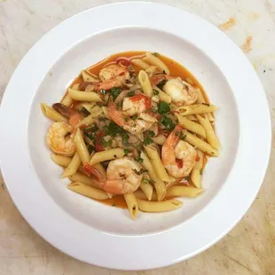 a bowl of pasta with shrimp