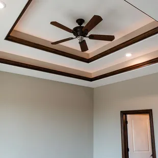 a ceiling fan in a bedroom