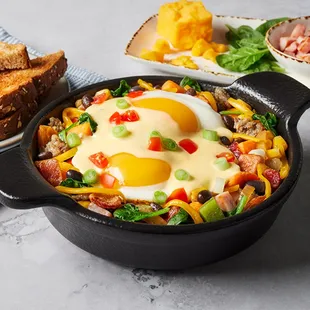 a skillet with eggs and vegetables