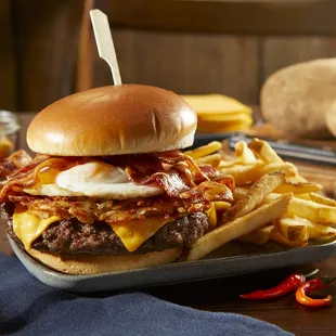 a burger and french fries on a tray