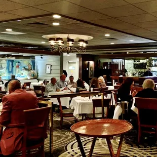 Patrons enjoying fine food and music.