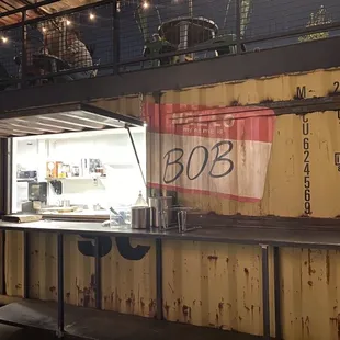 Pizza counter at the back of the Recess patio. If you're sitting inside, order from your server.