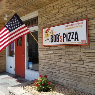 an american flag outside of a restaurant