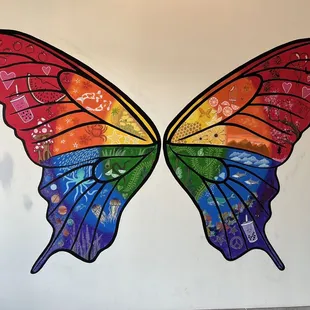 a colorful butterfly painted on a wall