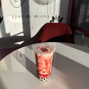 Strawberry shake with strawberry jelly hearts and boba