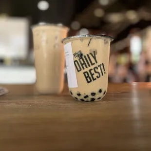 a cup of coffee with a sticker on it