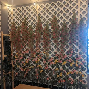 a wall of flowers and vines