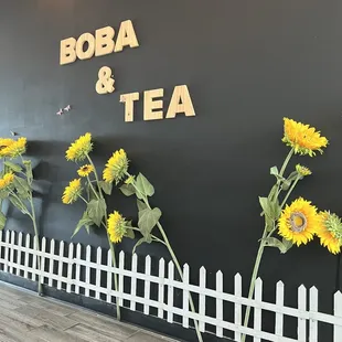sunflowers and a picket fence